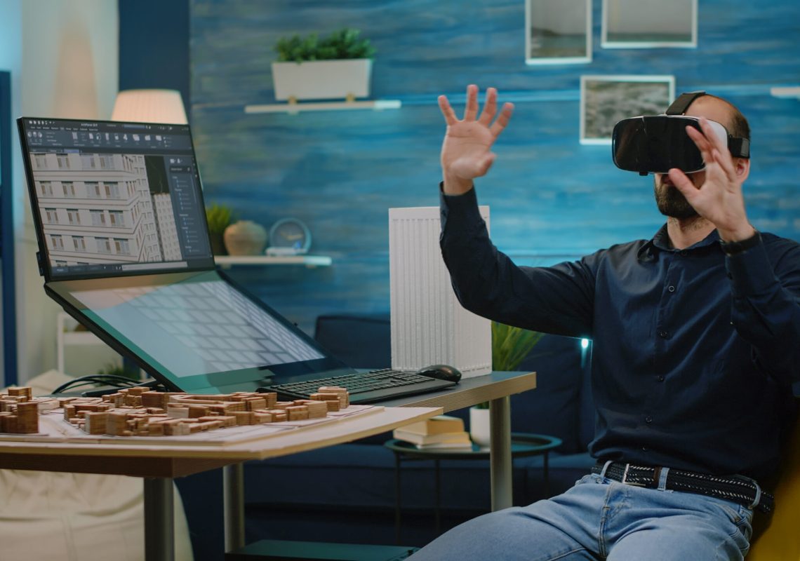 Architect using vr glasses for building model design in architectural office. Man engineer working with headset and virtual reality to analyze construction layout and development.