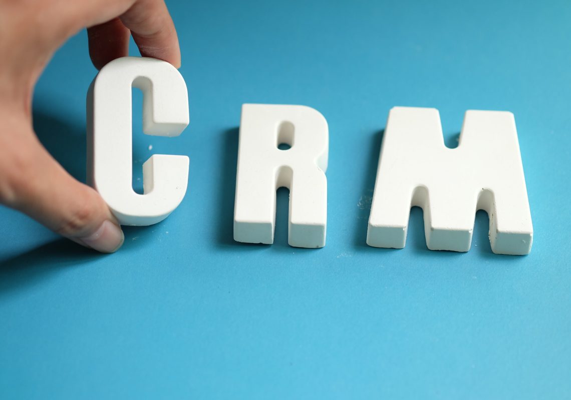 Hand arrange white letters as CRM