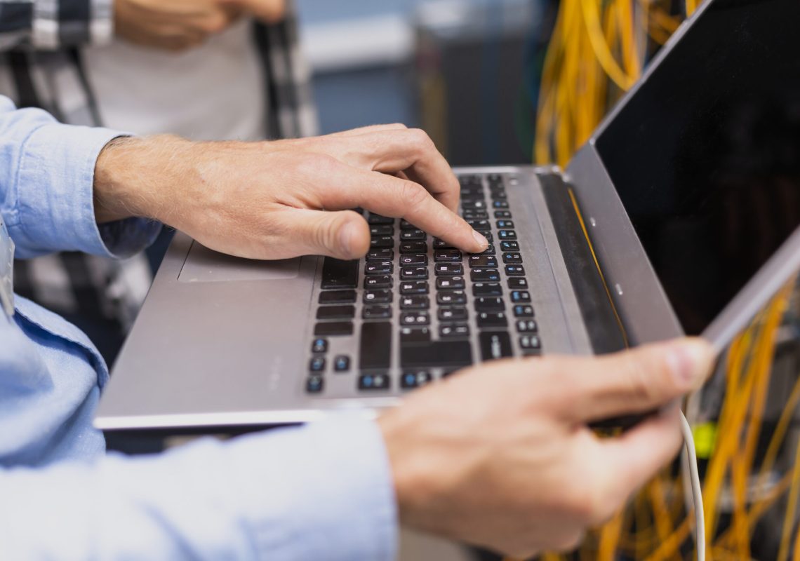 person-typing-laptop-close-up